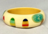 SZ93 Shultz custard bakelite bangle with laminated fingernail dots